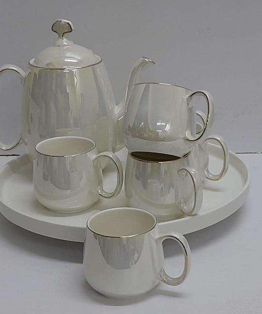 White gold tea set with a round tray